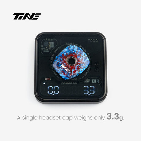 TiNE Top Cap de Carbono FDJ Team Edition sobre una báscula que marca 3,3 g