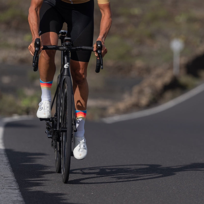 Cyclist riding with white Zuatu road shoes